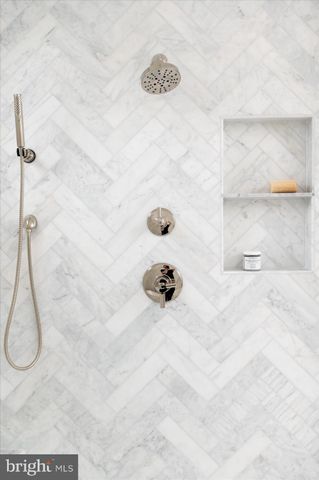 a white bath tub sitting in a bathroom