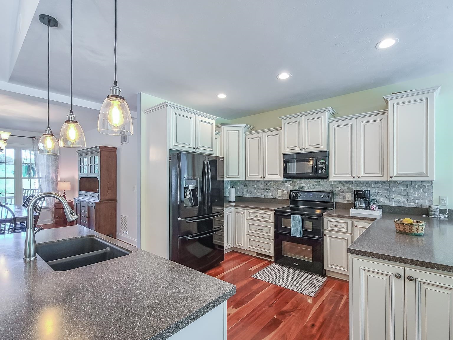 6089 Faughts Road Mount Crawford, VA 22841 - Photo 11 of 68 a kitchen with stainless steel appliances granite countertop a sink refrigerator and cabinets