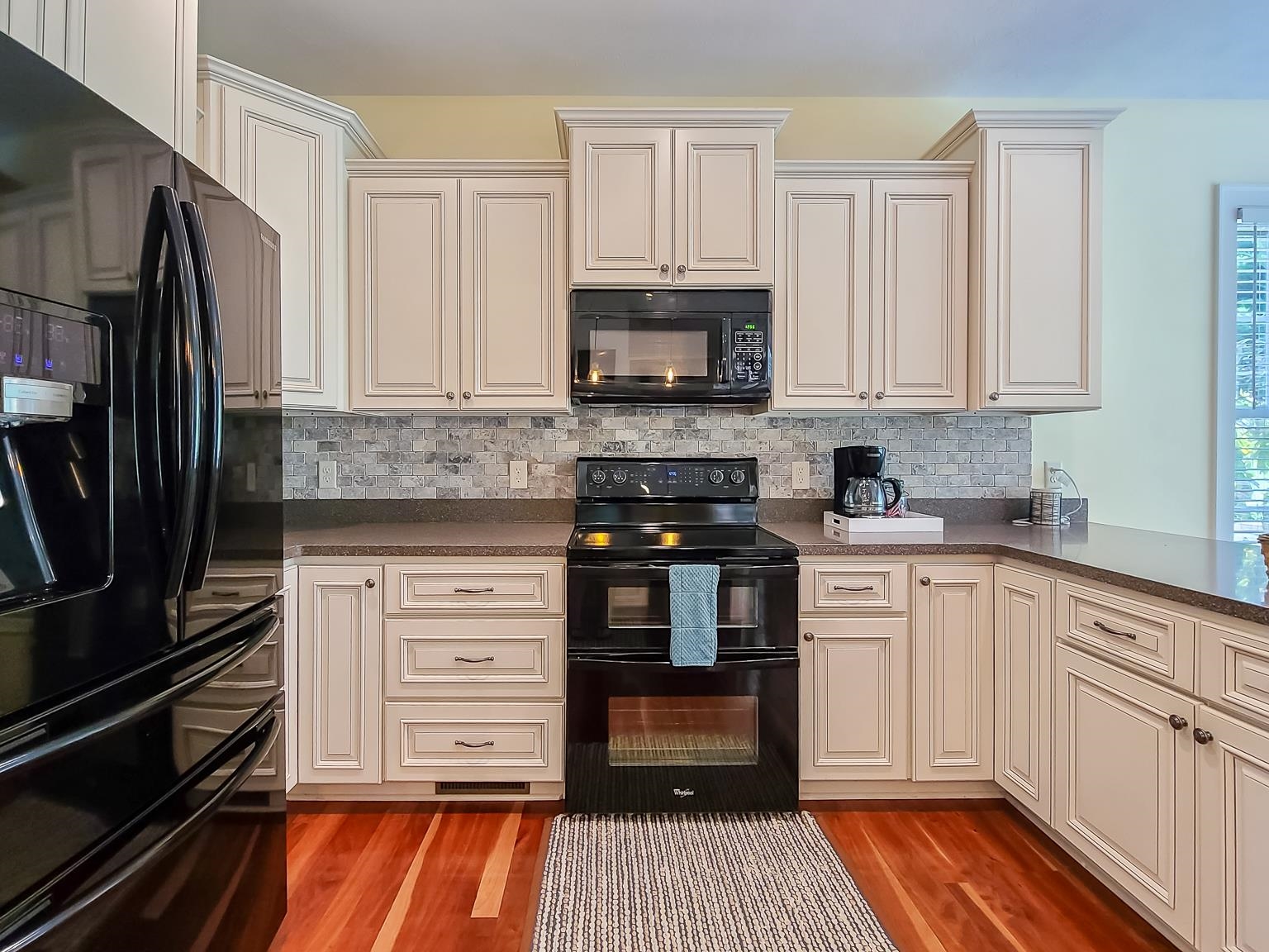 6089 Faughts Road Mount Crawford, VA 22841 - Photo 15 of 68 a kitchen with stainless steel appliances granite countertop a stove and white cabinets
