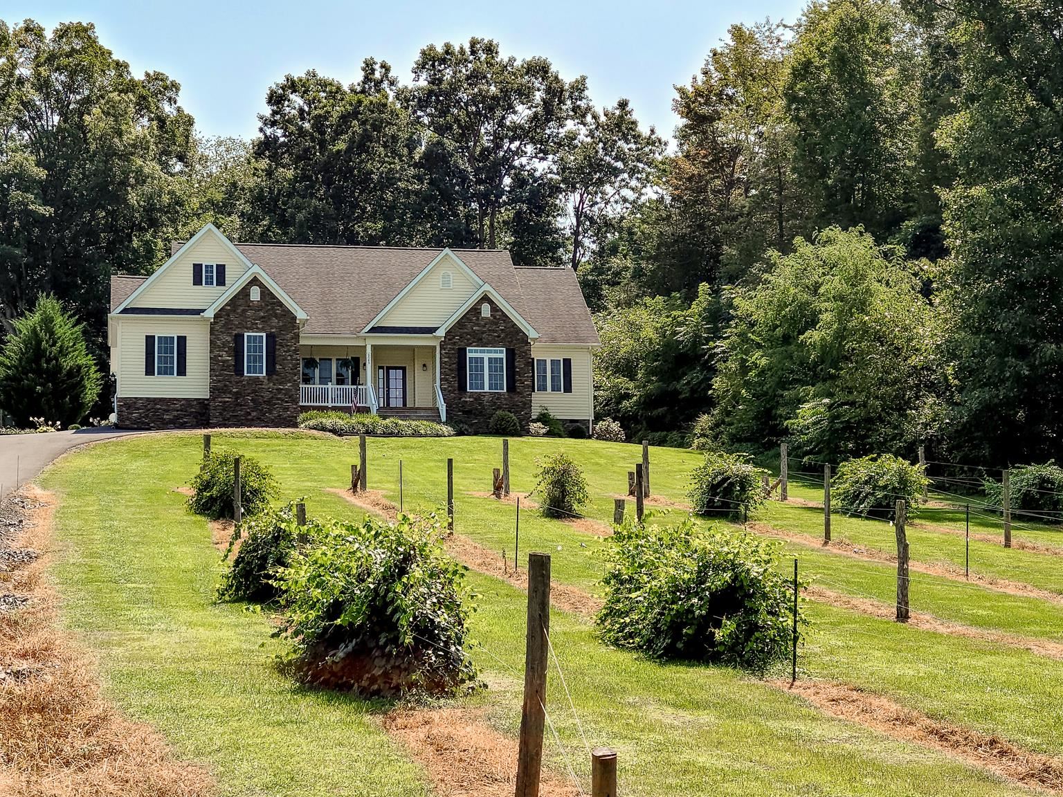 6089 Faughts Road Mount Crawford, VA 22841 - Photo 57 of 68 a front view of a house with a yard table and chairs