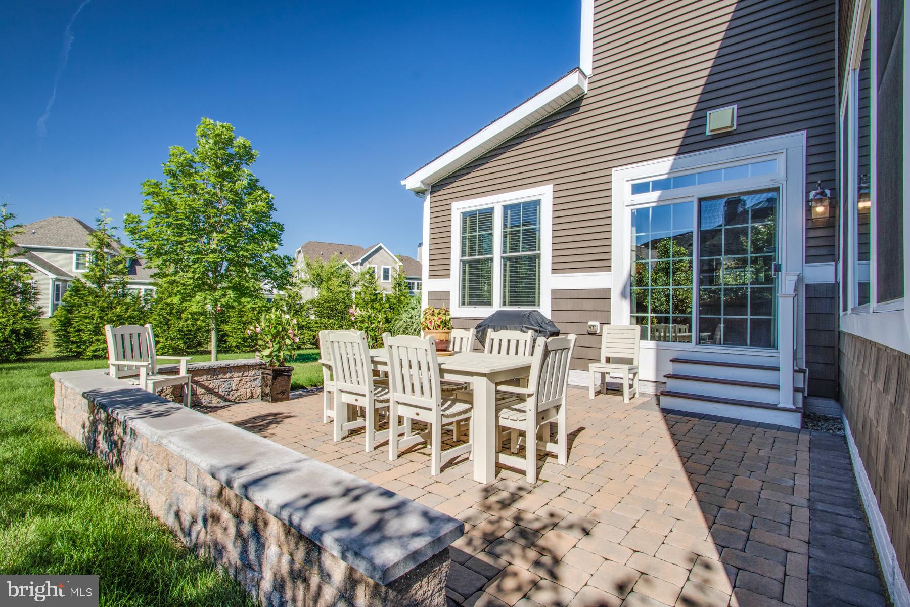 16611 Shoal Road Lewes, DE 19958 - Photo 44 of 60 Paver patio and nice back yard with mature trees