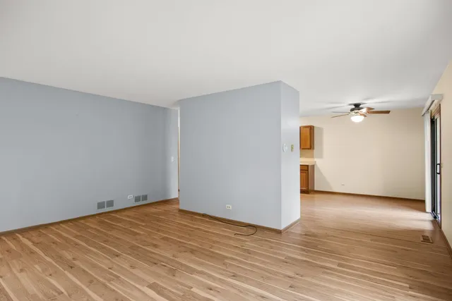 a view of a room with wooden floor