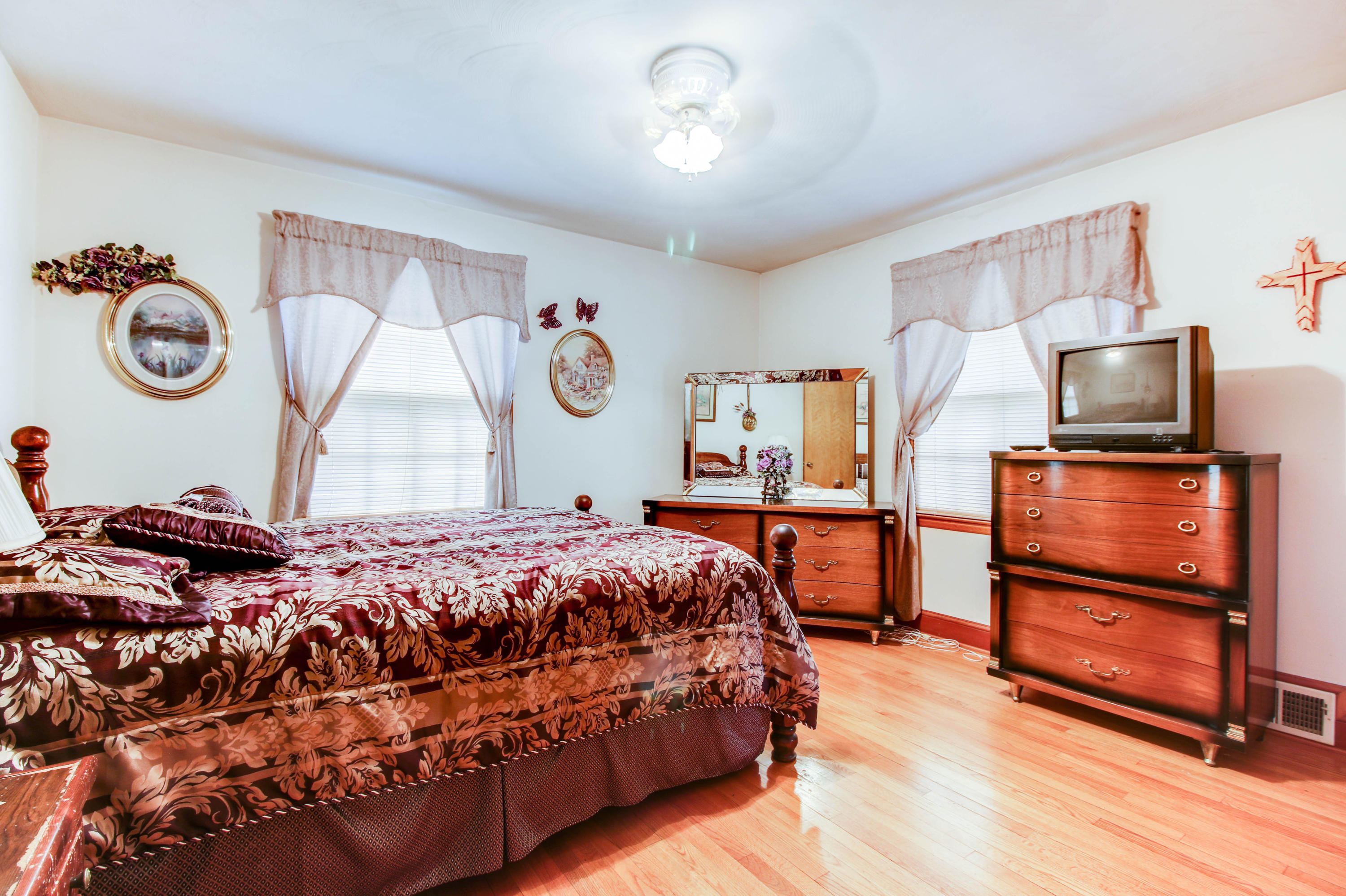 499 Thompson Ridge Circle Ferrum, VA 24088 - Photo 14 of 21 a bedroom with a bed and wooden floor