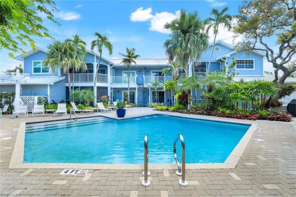 376 3rd Street South, Unit 102 Naples, FL 34102 - Photo 17 of 17 Swimming pool with a patio area and a balcony