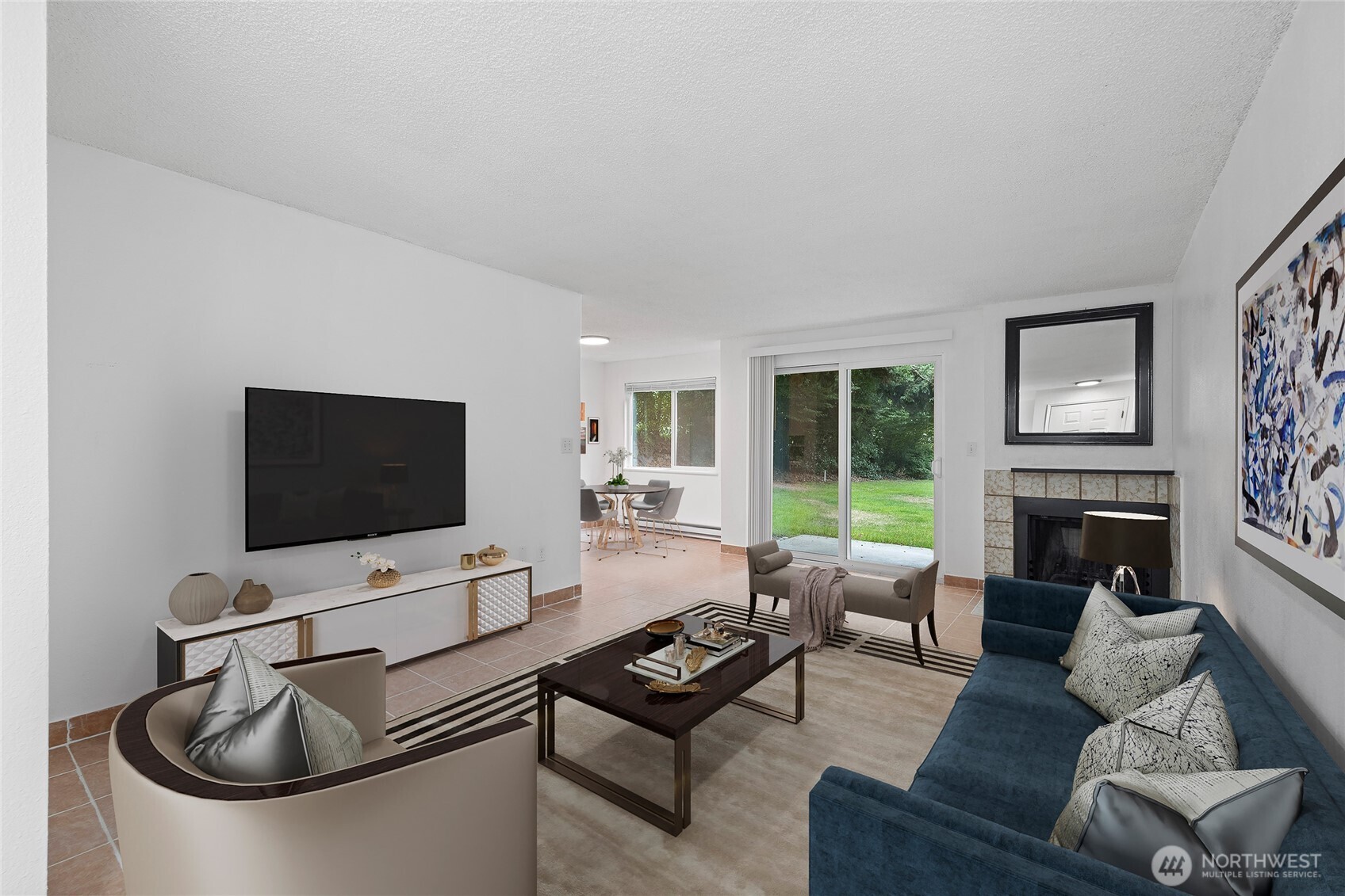 a living room with furniture a flat screen tv and a fireplace