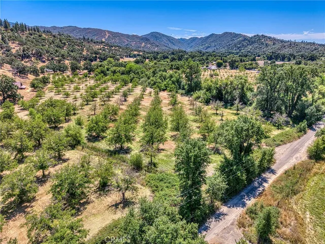 a view of a town with mountains in the background