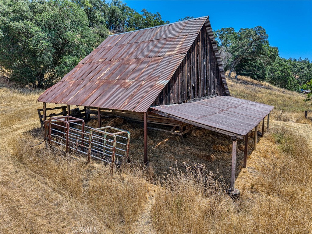 1286 Pitney Lane Upper Lake, CA 95485 - Photo 24 of 31 a view of a wooden house with a yard and furniture
