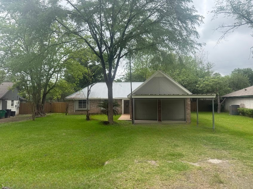 5410 Dibello Forest Lane Spring, TX 77373 - Photo 1 of 13 a white house with a big yard and large trees