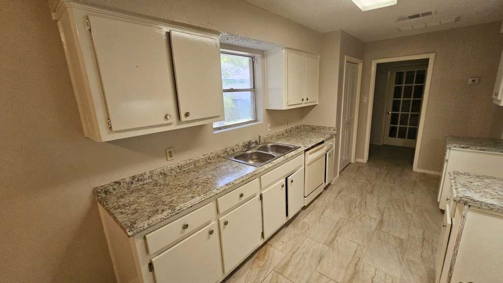 5410 Dibello Forest Lane Spring, TX 77373 - Photo 4 of 11 a kitchen with stainless steel appliances granite countertop a stove and a sink