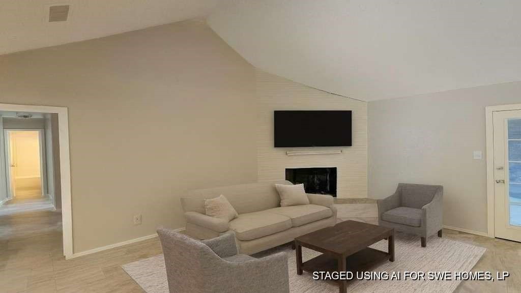 5410 Dibello Forest Lane Spring, TX 77373 - Photo 7 of 13 a living room with furniture a rug and a fireplace
