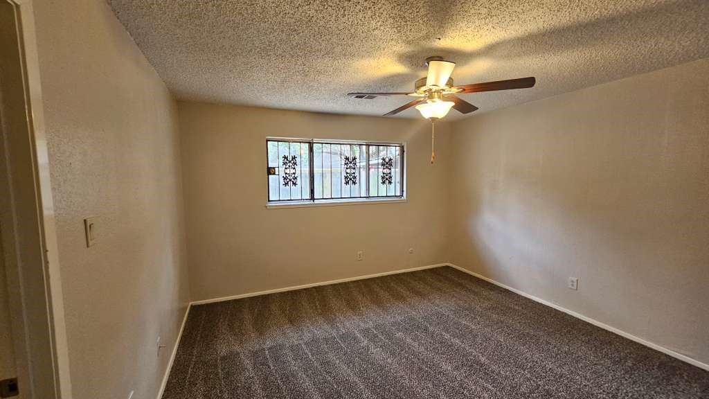 5410 Dibello Forest Lane Spring, TX 77373 - Photo 8 of 11 wooden floor in an empty room with a window