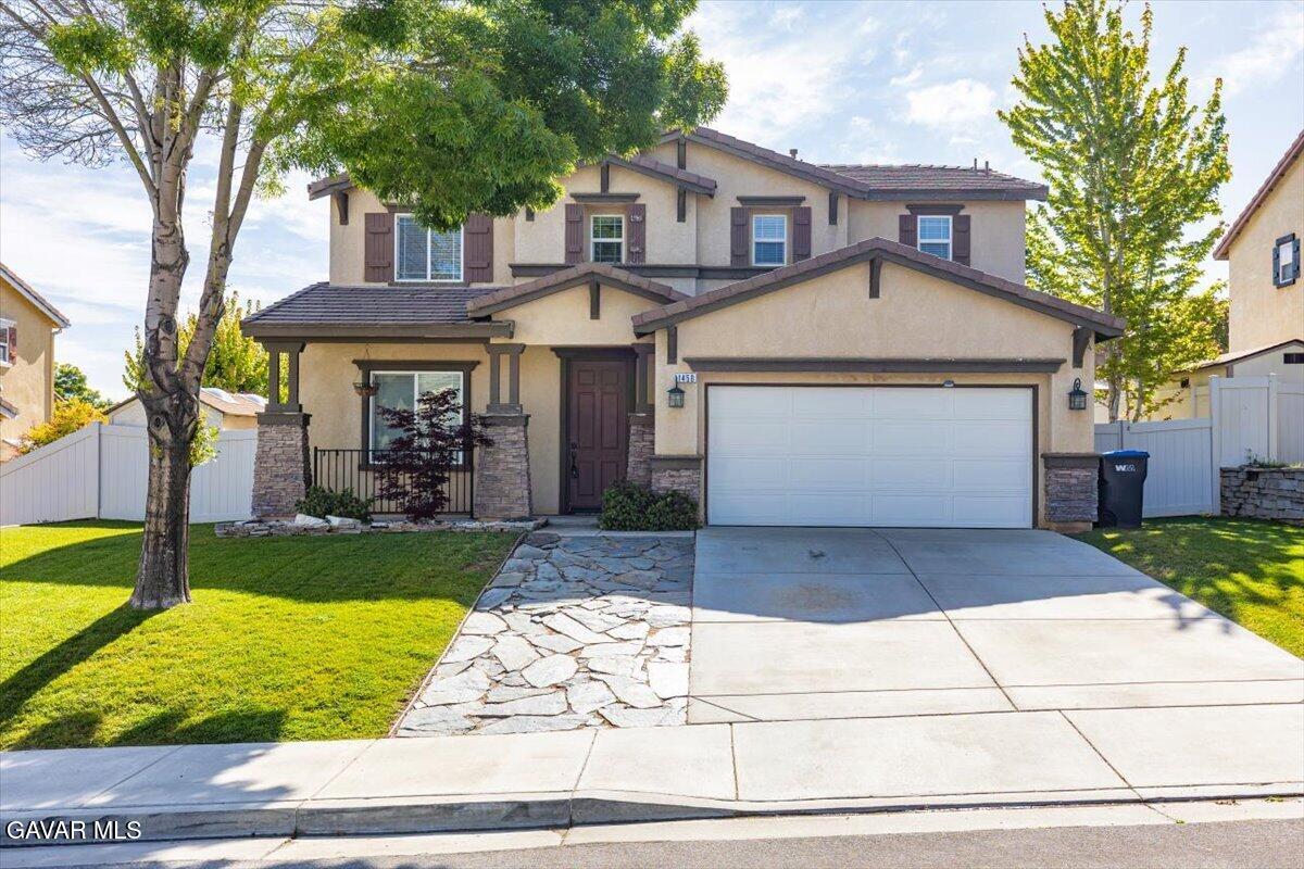 1450 Green Street Tehachapi, CA 93561 - Photo 1 of 27 a front view of a house with garden