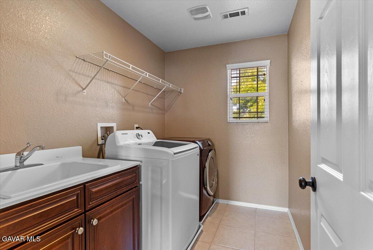 1450 Green Street Tehachapi, CA 93561 - Photo 11 of 27 a utility room with dryer and washer