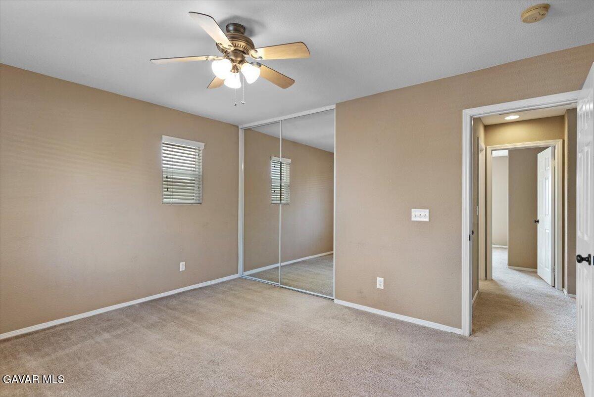 1450 Green Street Tehachapi, CA 93561 - Photo 14 of 27 a view of an empty room with a chandelier fan