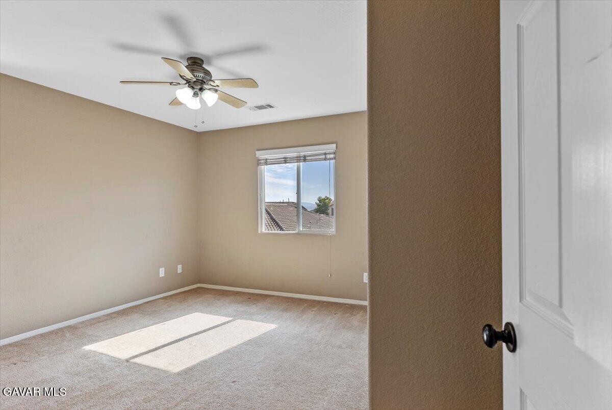1450 Green Street Tehachapi, CA 93561 - Photo 16 of 27 an empty room with windows and fan