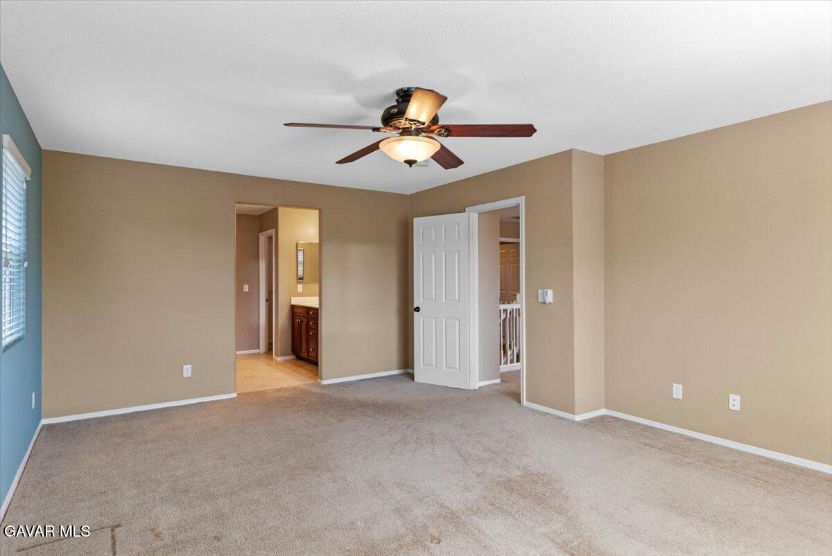 1450 Green Street Tehachapi, CA 93561 - Photo 19 of 27 a view of a room with a ceiling fan window and closet