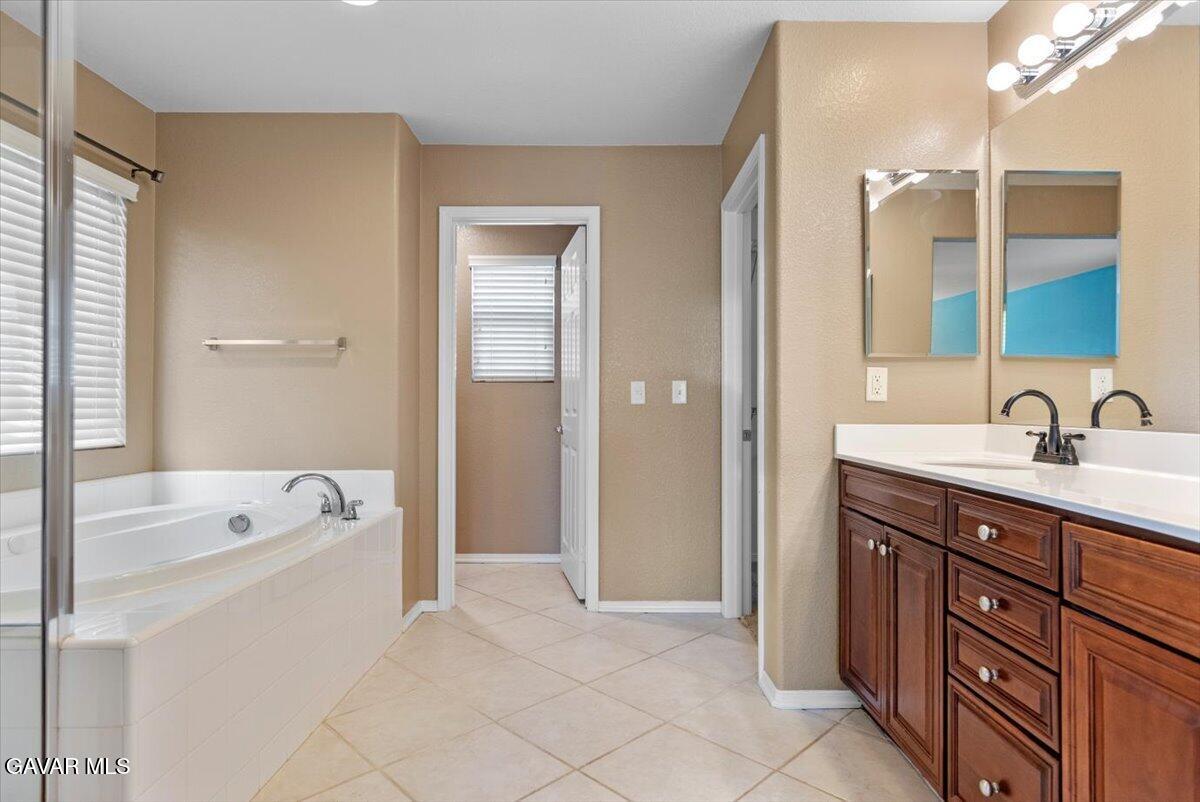 1450 Green Street Tehachapi, CA 93561 - Photo 20 of 27 a bathroom with a tub sink double vanity and tub