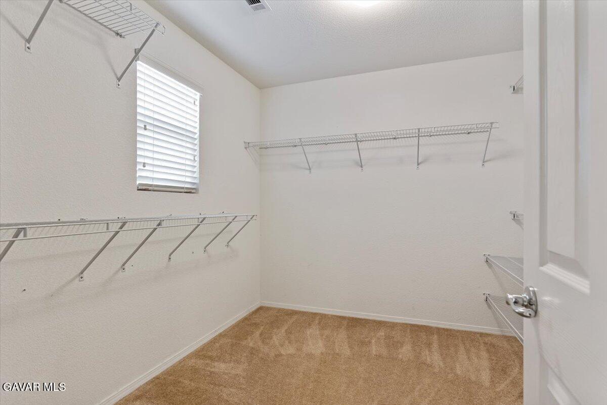 1450 Green Street Tehachapi, CA 93561 - Photo 21 of 27 a view of a room with racks on the wall