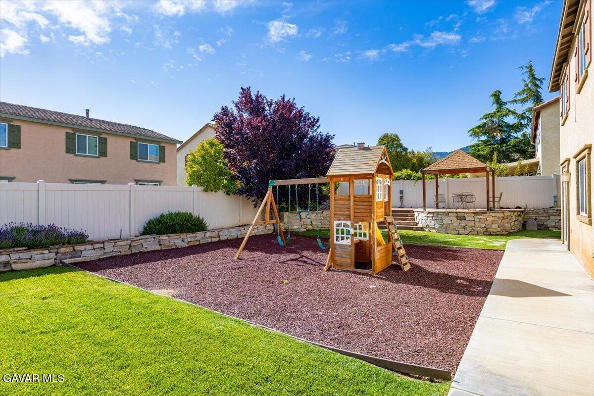 1450 Green Street Tehachapi, CA 93561 - Photo 23 of 27 a view of a house with backyard porch and sitting area
