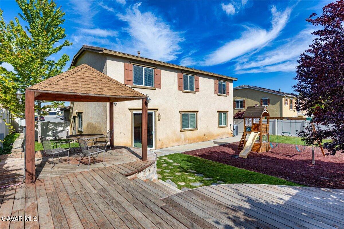 1450 Green Street Tehachapi, CA 93561 - Photo 24 of 27 a front view of a house with a yard table and chairs