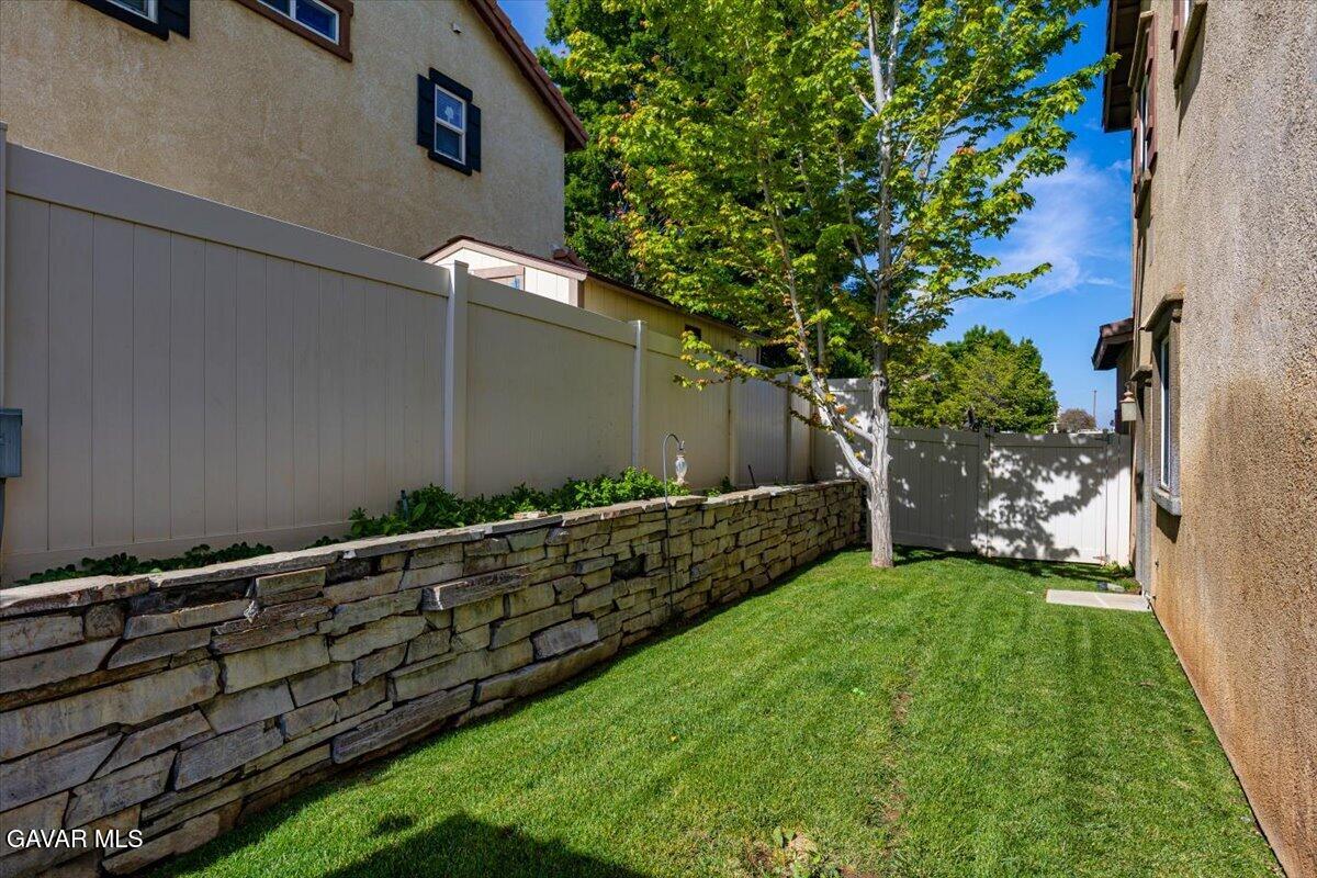 1450 Green Street Tehachapi, CA 93561 - Photo 25 of 27 a backyard of a house with lots of green space