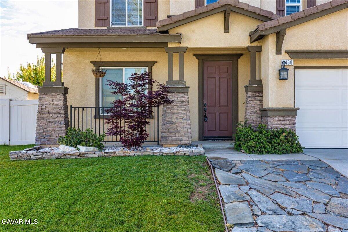 1450 Green Street Tehachapi, CA 93561 - Photo 3 of 27 a front view of a house with garden