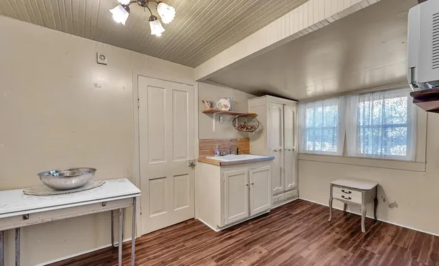 a kitchen with a refrigerator and window