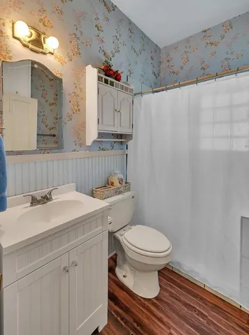 a living room with furniture a piano and a window
