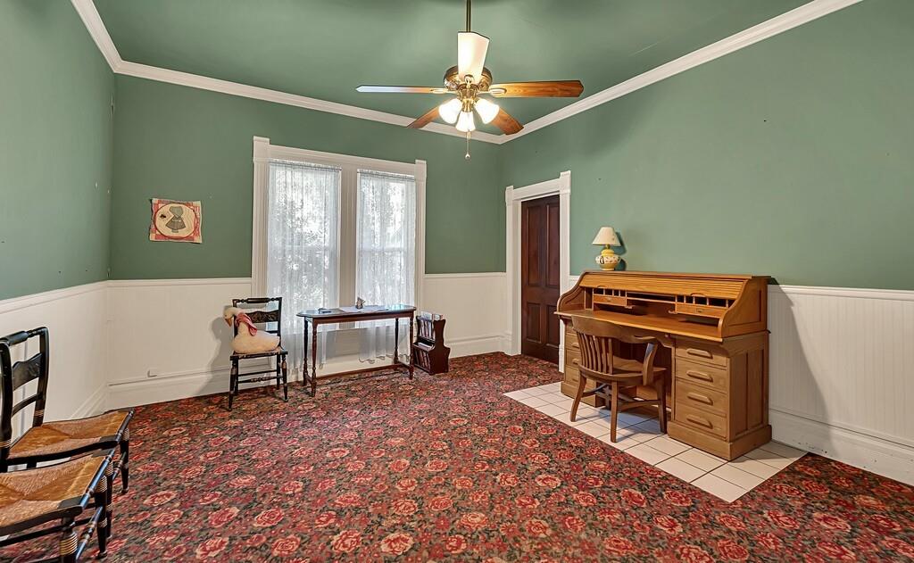 515 Hackberry Street Clifton, TX 76634 - Photo 20 of 40 a living room with furniture a piano and a window