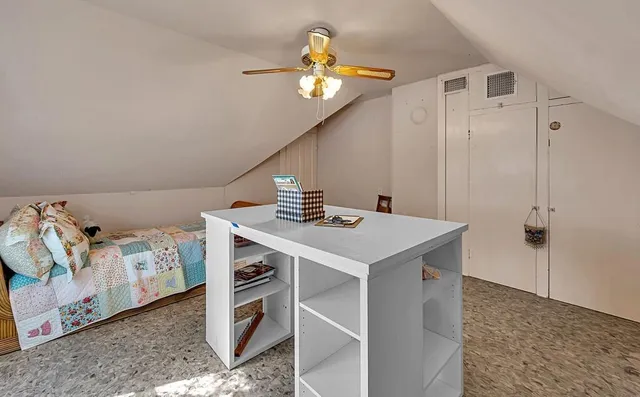 a bedroom with furniture and a chandelier