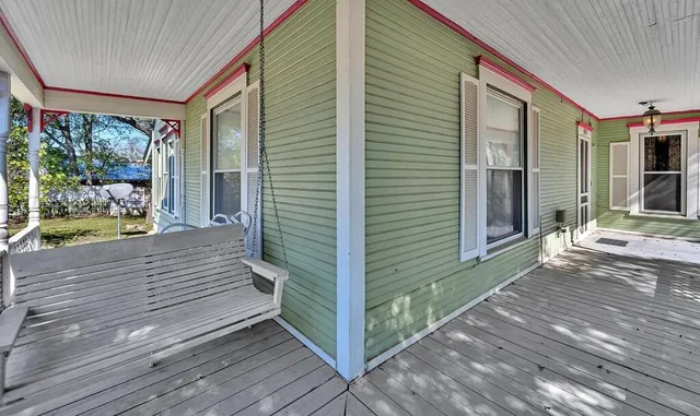 a front view of house with a garden