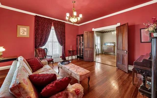 a living room with furniture a dining table and chairs