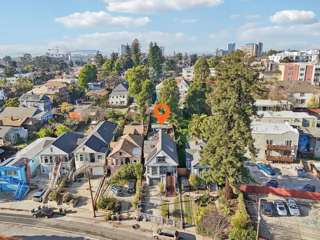 an aerial view of residential houses with outdoor space