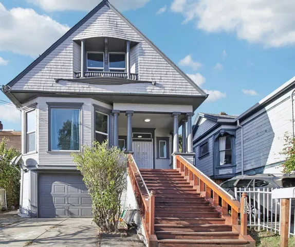 a view of a room with furniture and wooden floor