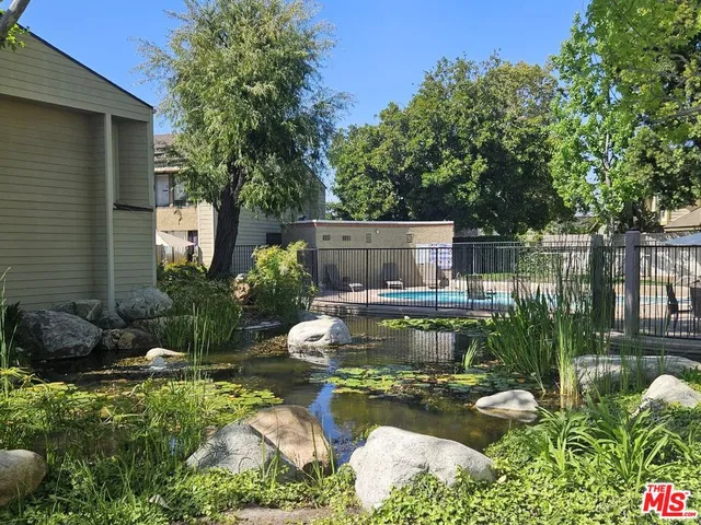a view of a swimming pool with a patio