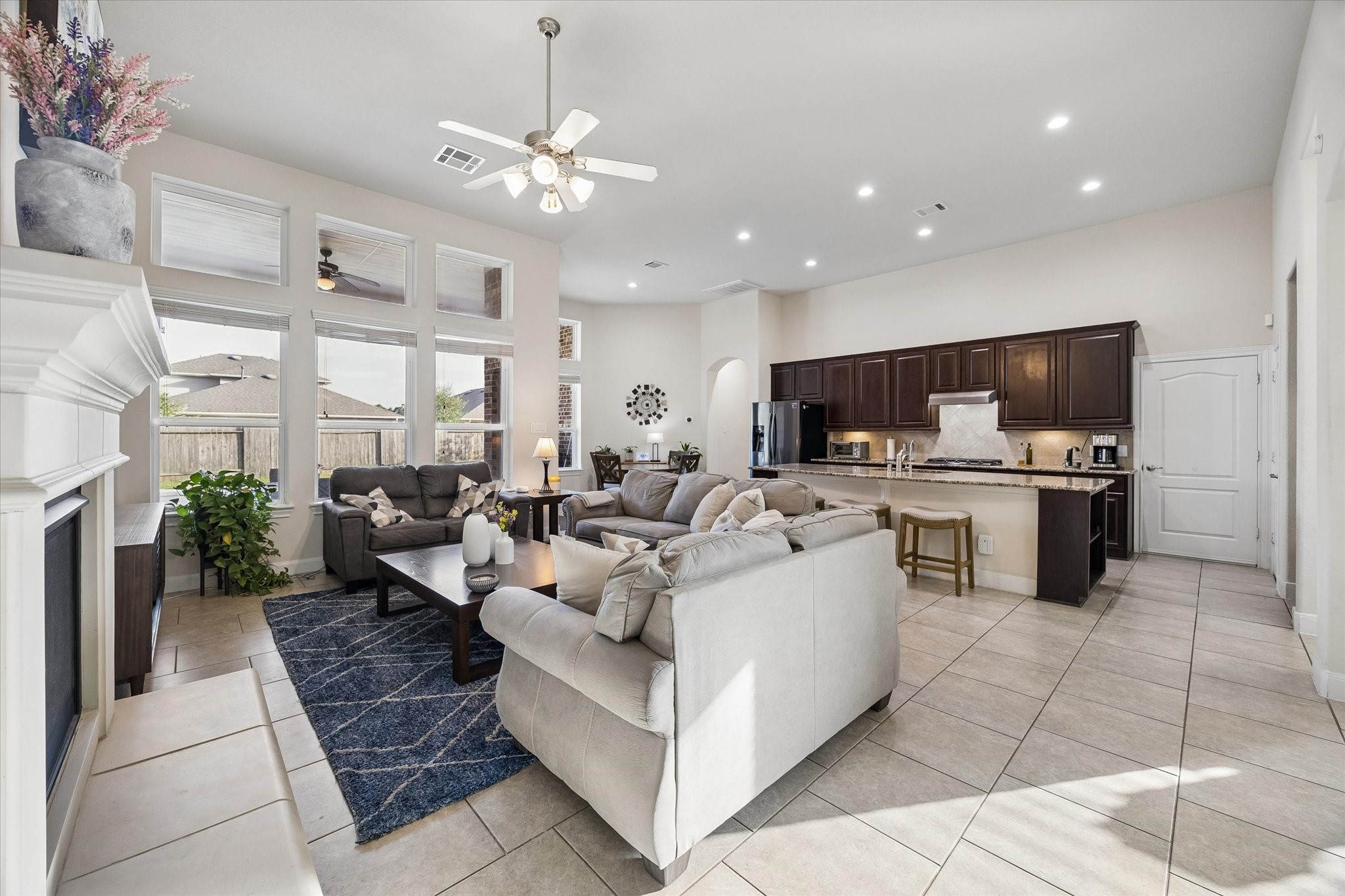 3306 Explorer Way Conroe, TX 77301 - Photo 12 of 35 The living area has direct views to the outside pool. Kitchen is open to the living areas.
