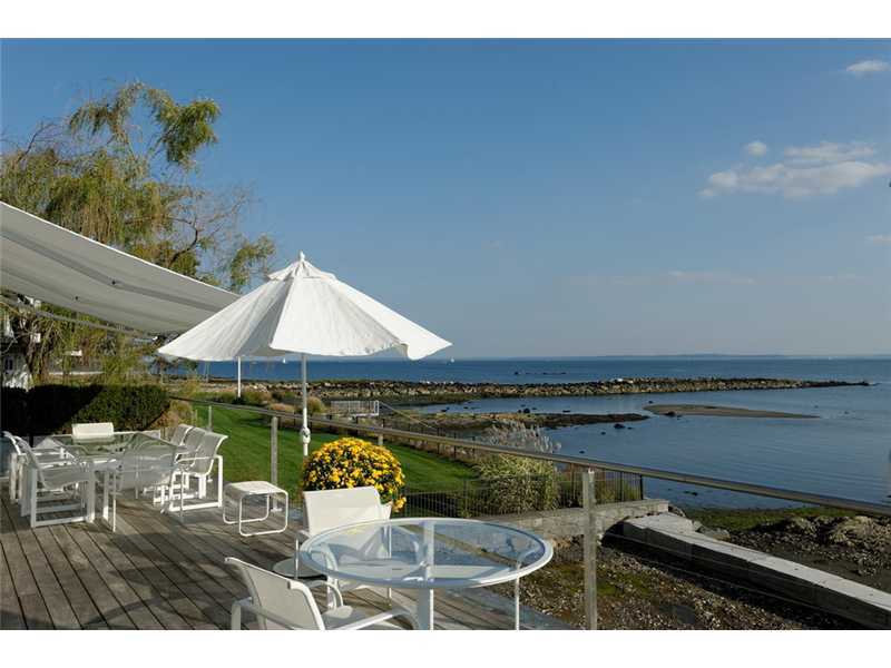 18 Rocky Point Road Old Greenwich, CT 06870 - Photo 1 of 16 a room with furniture and a umbrella