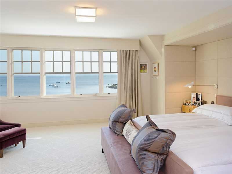 18 Rocky Point Road Old Greenwich, CT 06870 - Photo 11 of 16 a bedroom with a bed and a window