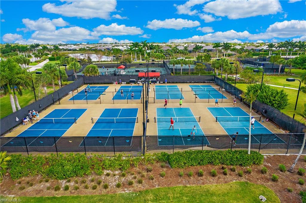 5060 Martinique Drive Naples, FL 34113 - Photo 34 of 38 a front view of a multi story building with yard