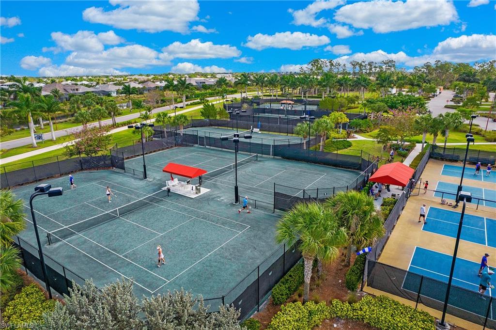 5060 Martinique Drive Naples, FL 34113 - Photo 35 of 38 an aerial view of a tennis ground and a terrace