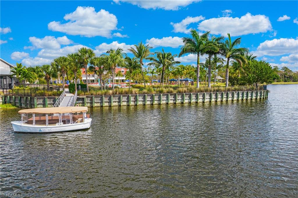 5060 Martinique Drive Naples, FL 34113 - Photo 37 of 38 a view of swimming pool with table and chairs
