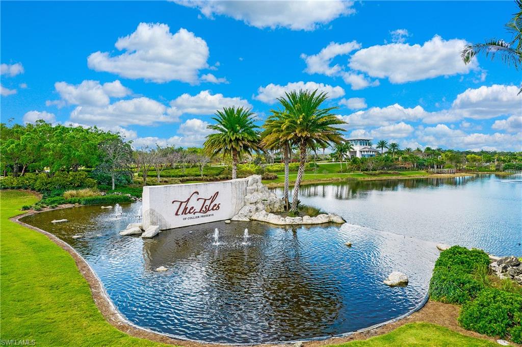 5060 Martinique Drive Naples, FL 34113 - Photo 38 of 38 a view of a lake with a house