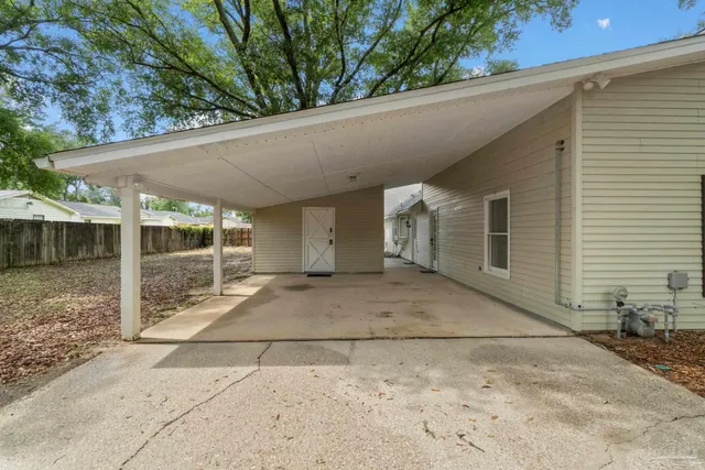 a view of backyard with large tree