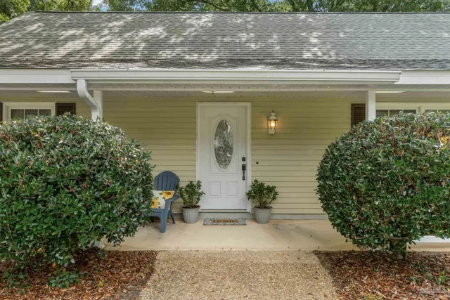 a front view of a house with garden