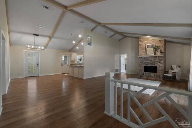 a view of a livingroom with furniture and a fireplace