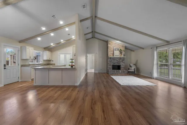 a view of kitchen with cabinets and wooden floor