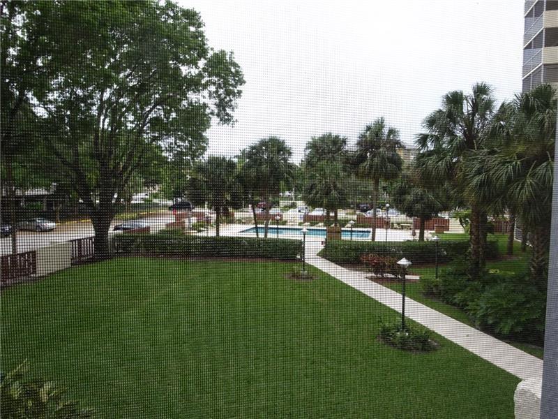10777 West Sample Road, Unit 1104 Coral Springs, FL 33065 - Photo 12 of 25 a view of park with tree s