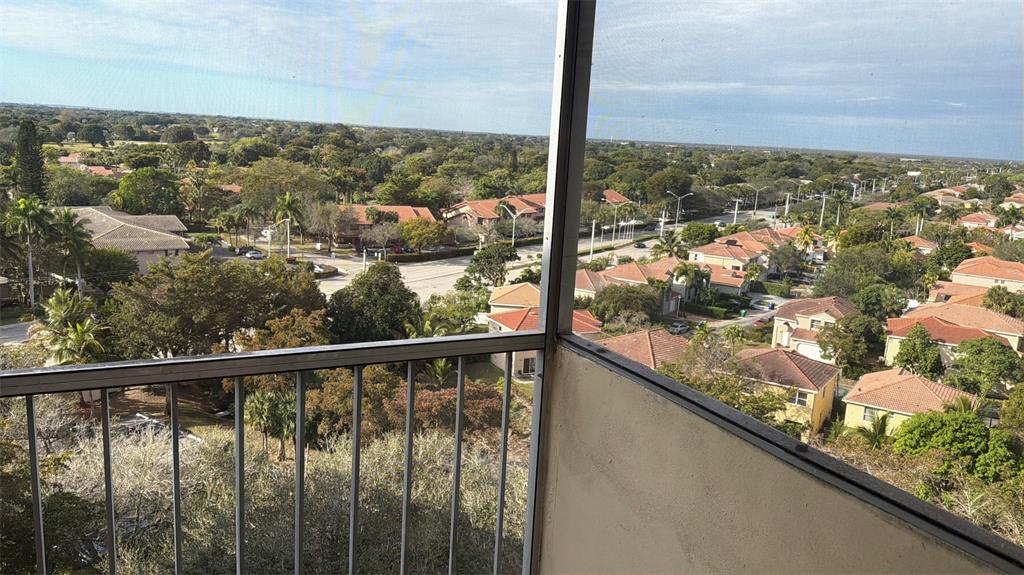 10777 West Sample Road, Unit 1104 Coral Springs, FL 33065 - Photo 24 of 25 a view of a city from a balcony