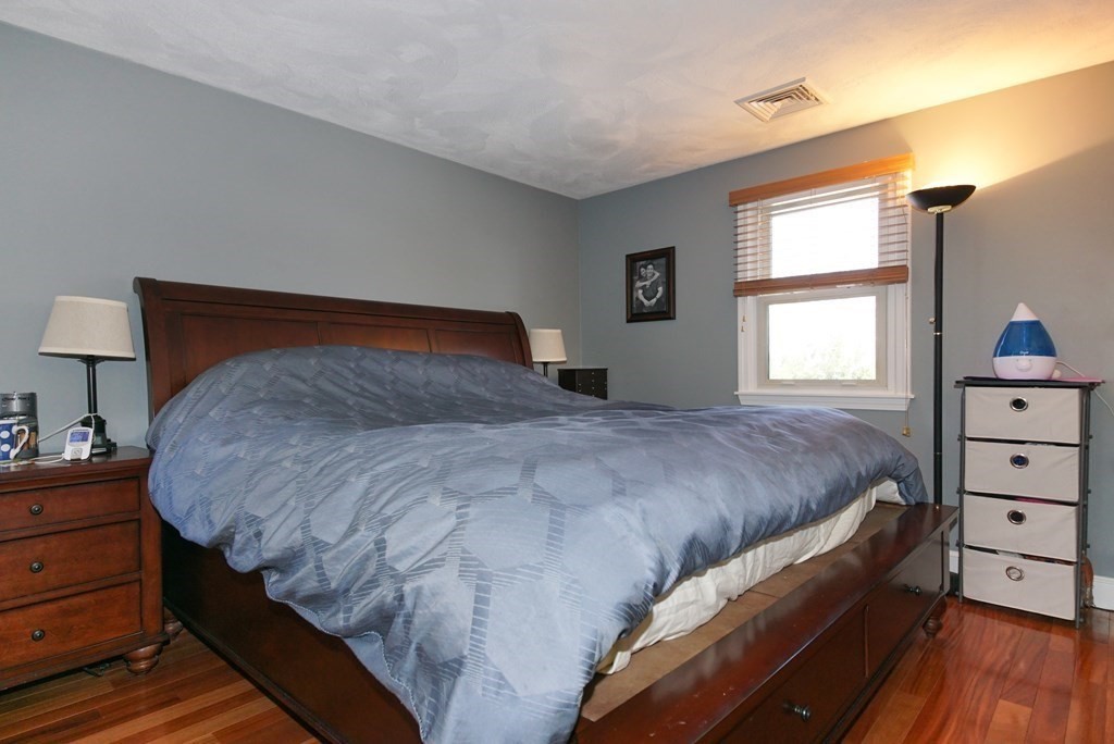 39 Locust Street Burlington, MA 01803 - Photo 11 of 27 a bedroom with a bed and a window
