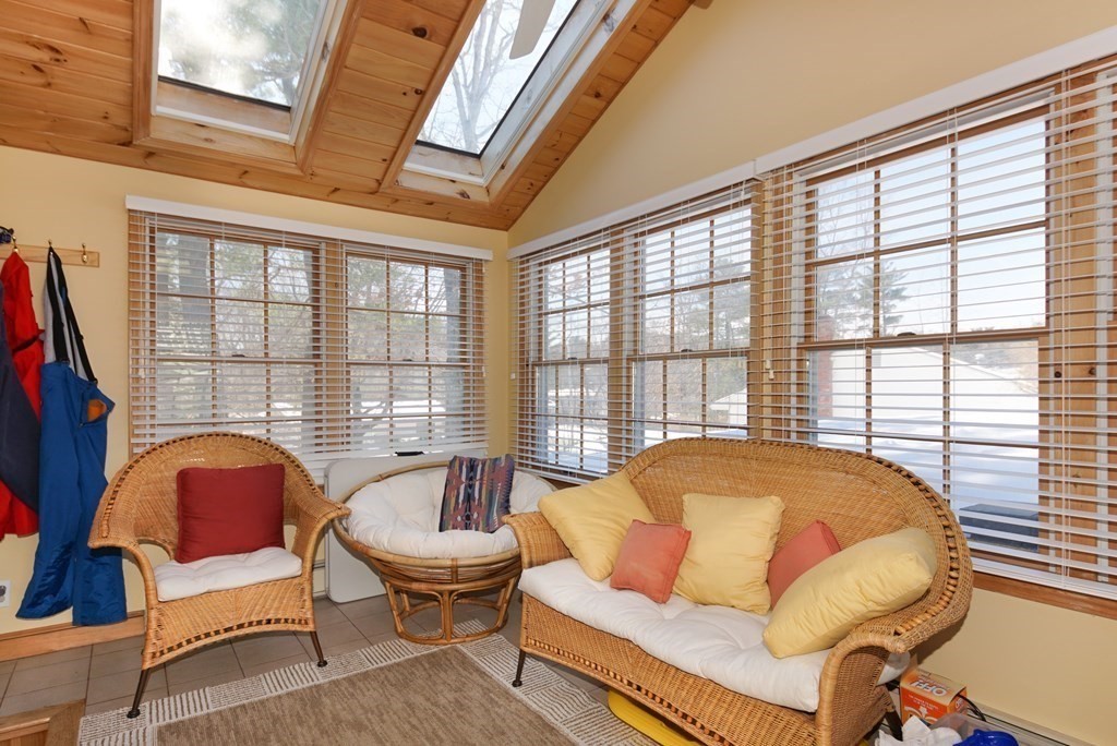 39 Locust Street Burlington, MA 01803 - Photo 13 of 27 a living room with furniture and a large window